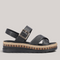 Grundy's Shoes Rieker V7951 black leather sandals with crossover straps, buckle detail, and patterned platform sole.