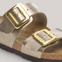 Grundy's Shoes Birkenstock Sydney sandal in metallic gold Birko-Flor with two large polished gold-tone buckles.