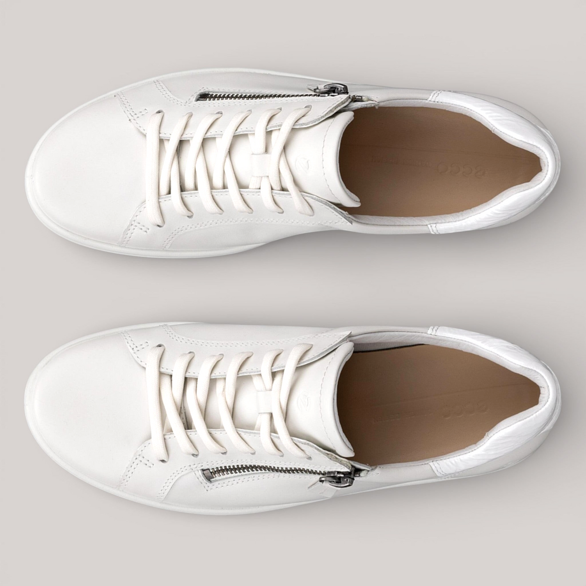 Grundy's Shoes ECCO Soft 7 white leather sneakers with side zip and lace-up closure, top-down view.