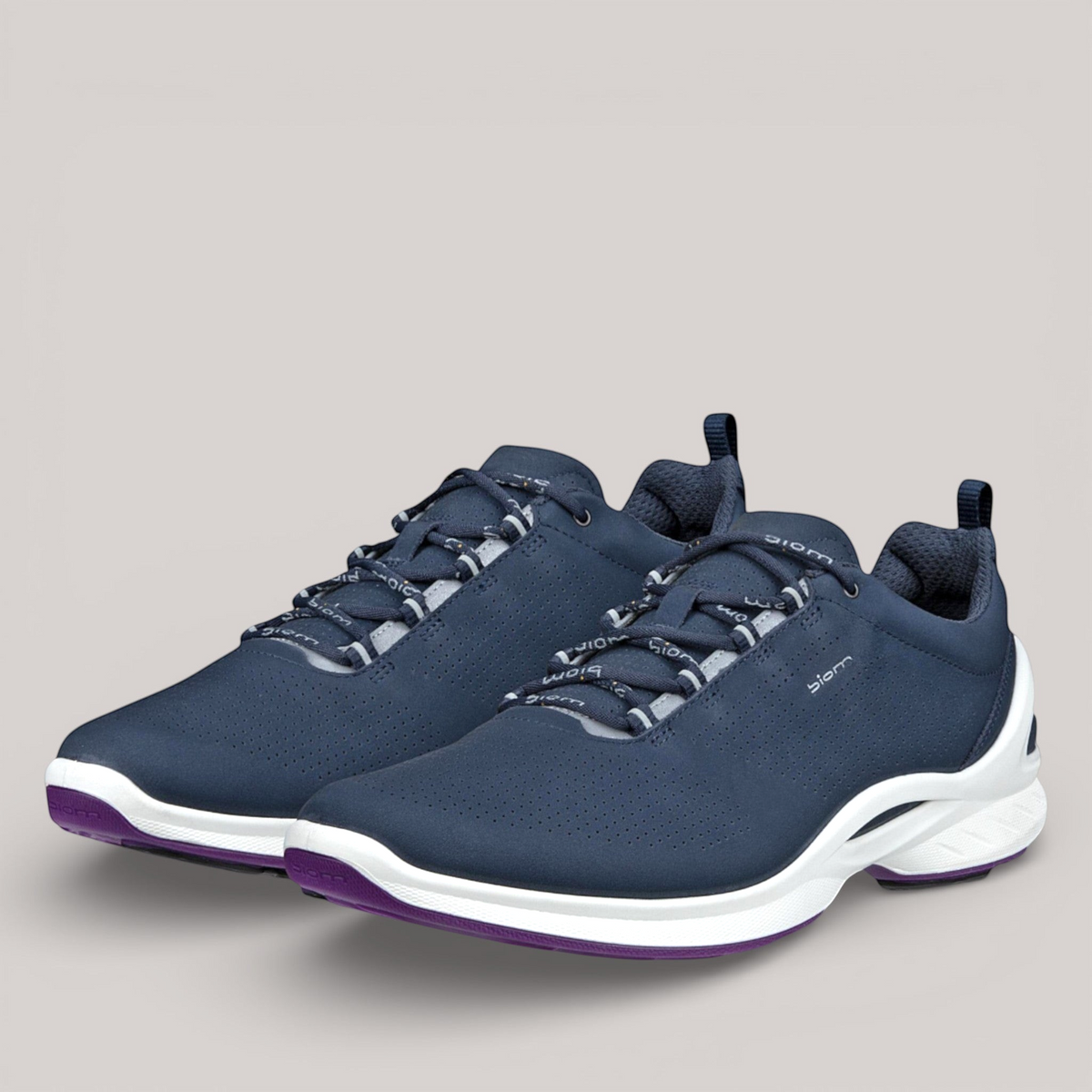 Grundy's Shoes ECCO Biom Fjuel women's navy leather sneakers with breathable perforations and white cushioned soles.