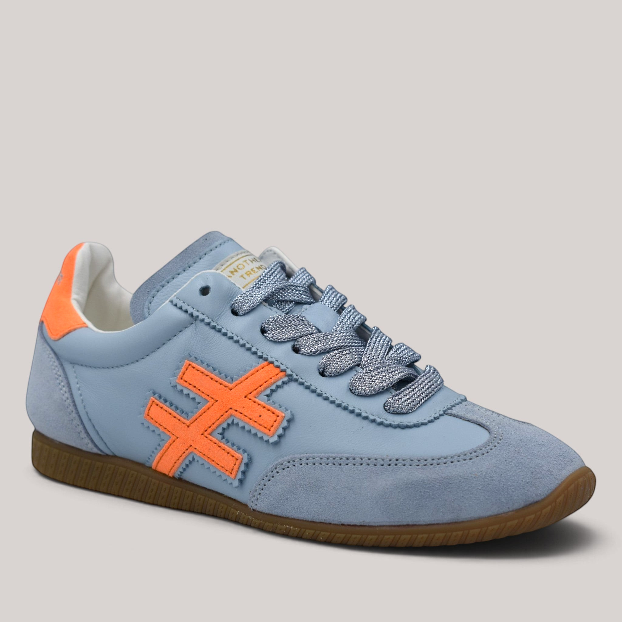 Grundy's Shoes Another Trend Atenas retro trainers in light blue leather and suede with orange accents and gum sole.
