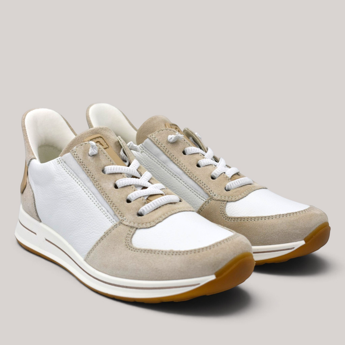 Grundy's Shoes Ara Osaka 2.0 white and beige leather sneakers with elastic laces and durable rubber soles.