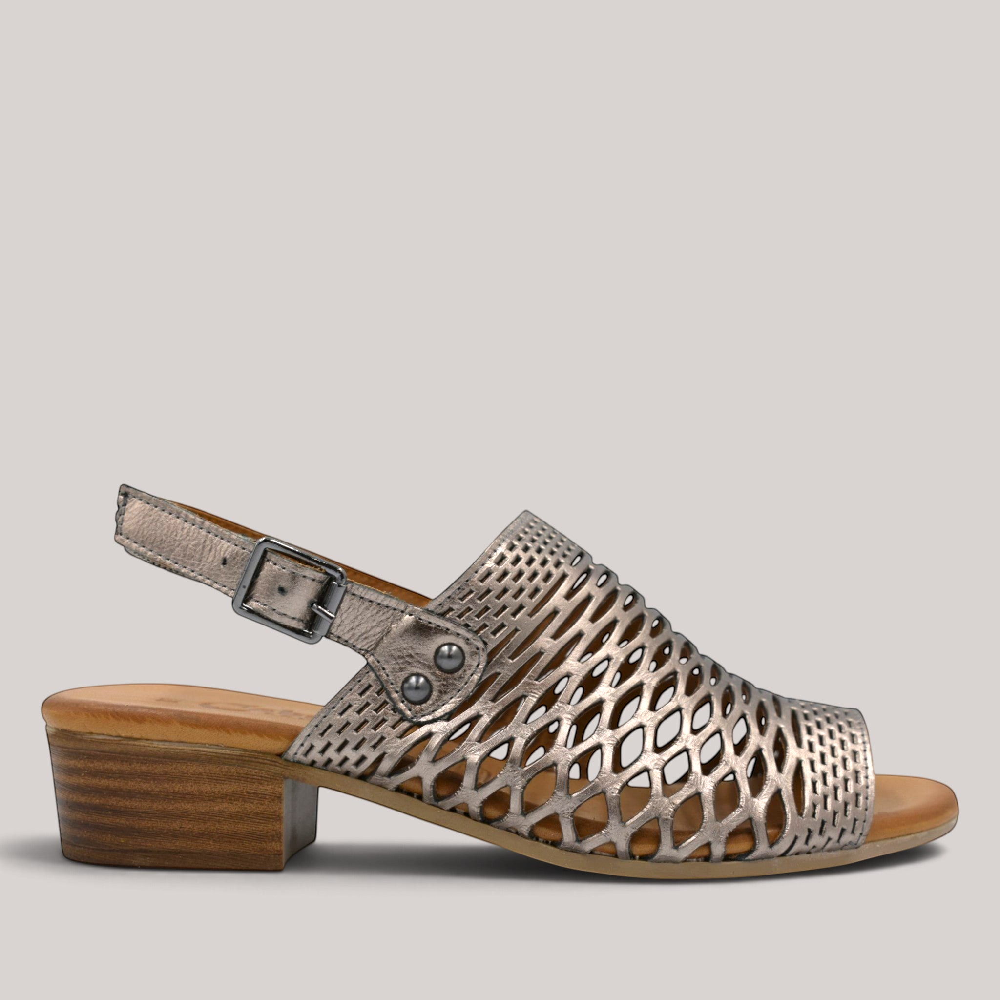 Grundy's Shoes Cabello Alaca metallic laser-cut leather sandal with a low block heel and adjustable slingback strap.