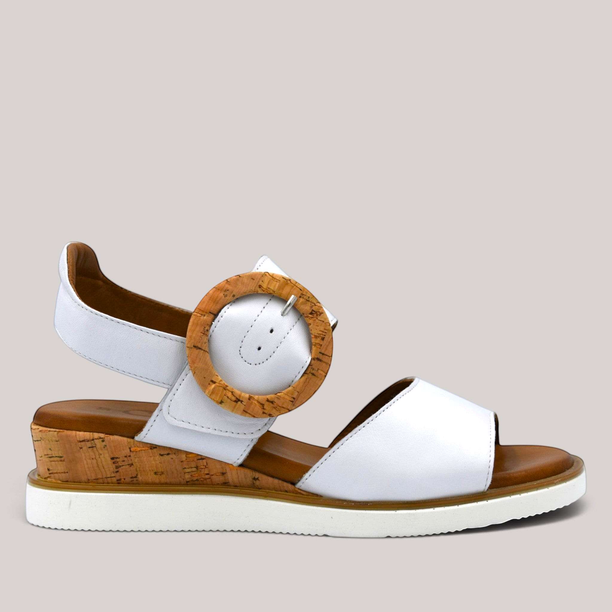 Grundy's Shoes Cabello Aspire white leather wedge sandal with a cork-effect buckle and wedge heel
