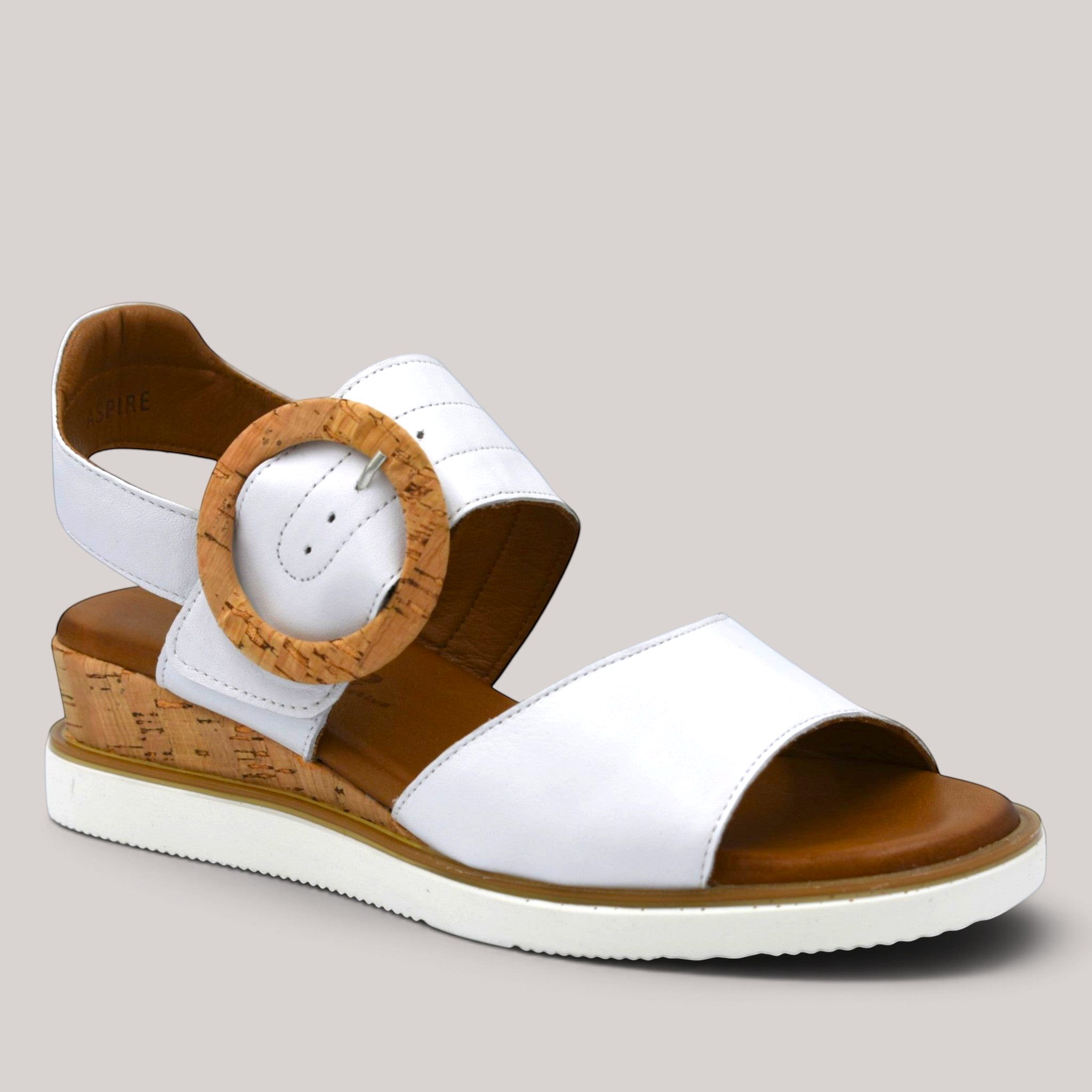 Grundy's Shoes Cabello Aspire white leather wedge sandal with a cork-look buckle and comfortable brown insole.