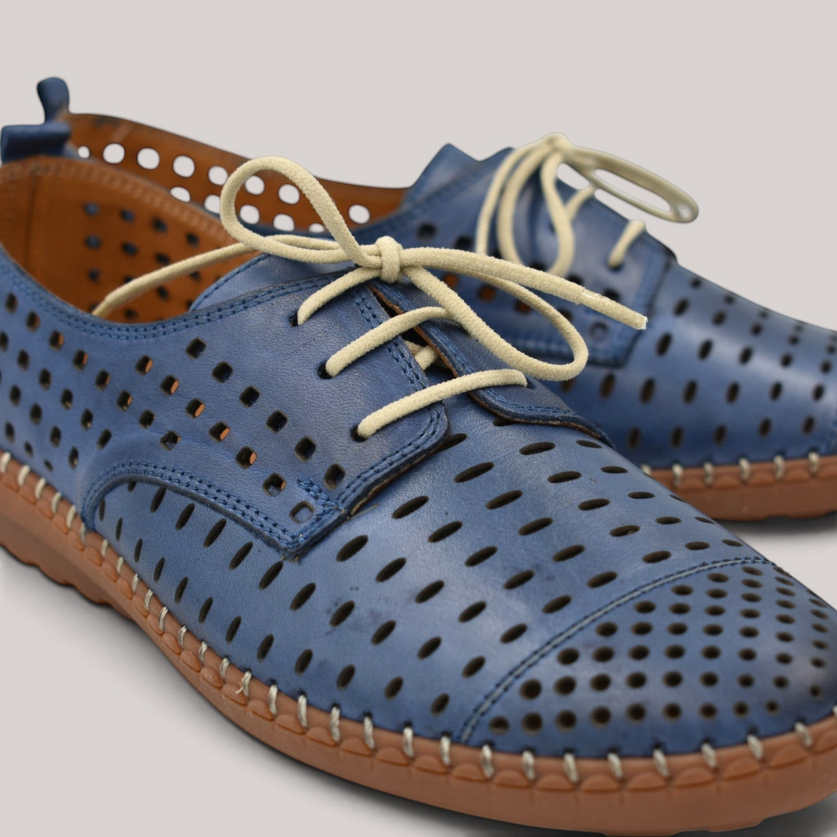 Grundy's Shoes Cabello Kroon blue perforated leather lace-up shoes with contrast stitching and padded insole.