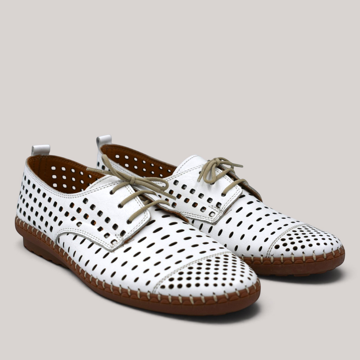 Grundy's Shoes Cabello Kroon white perforated leather lace-up shoes with contrast stitching and rubber sole.