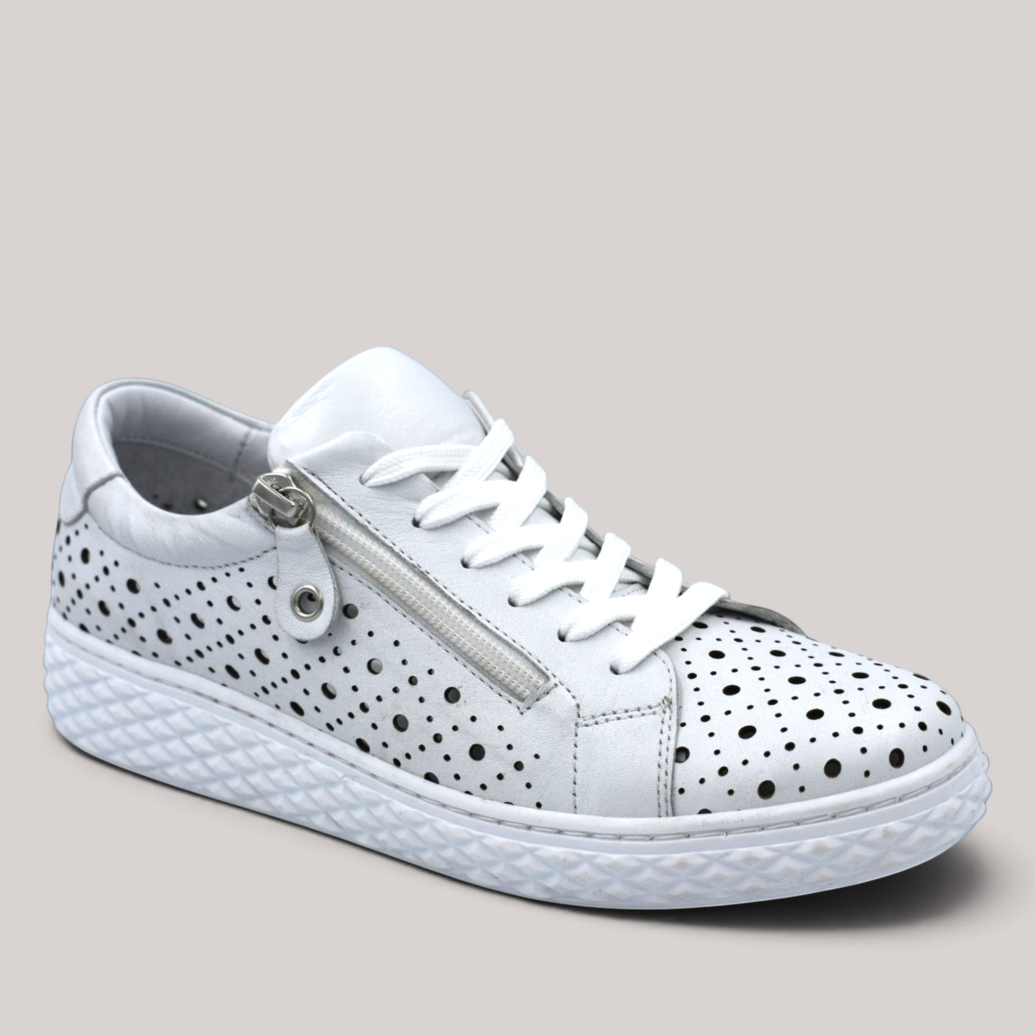 Grundy's Shoes Cabello Uptown white perforated leather sneaker with side zip and lace-up closure.