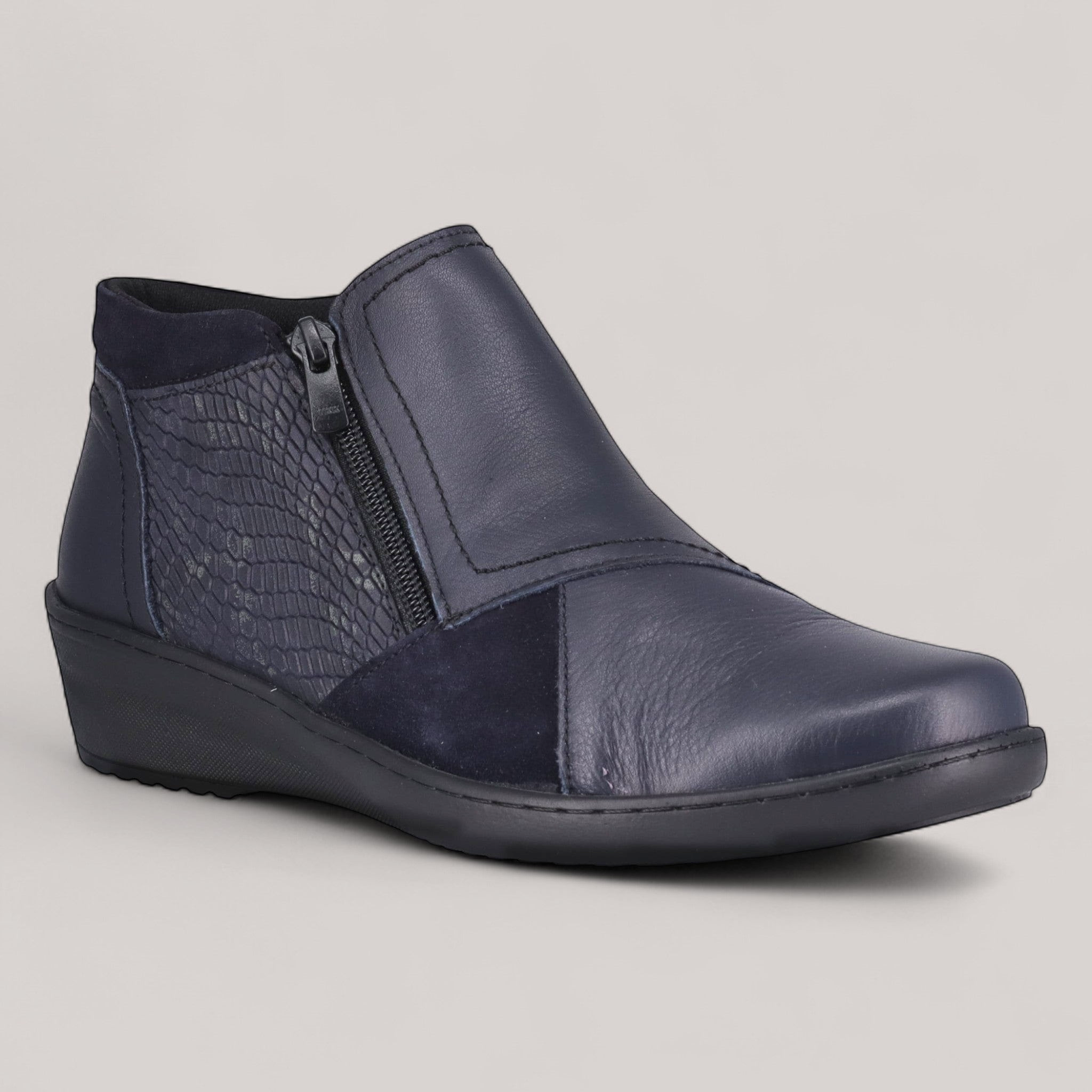 Grundy's Shoes Cabello navy leather wedge ankle boot with side zip, elastic gusset, and textured snake-skin detail.