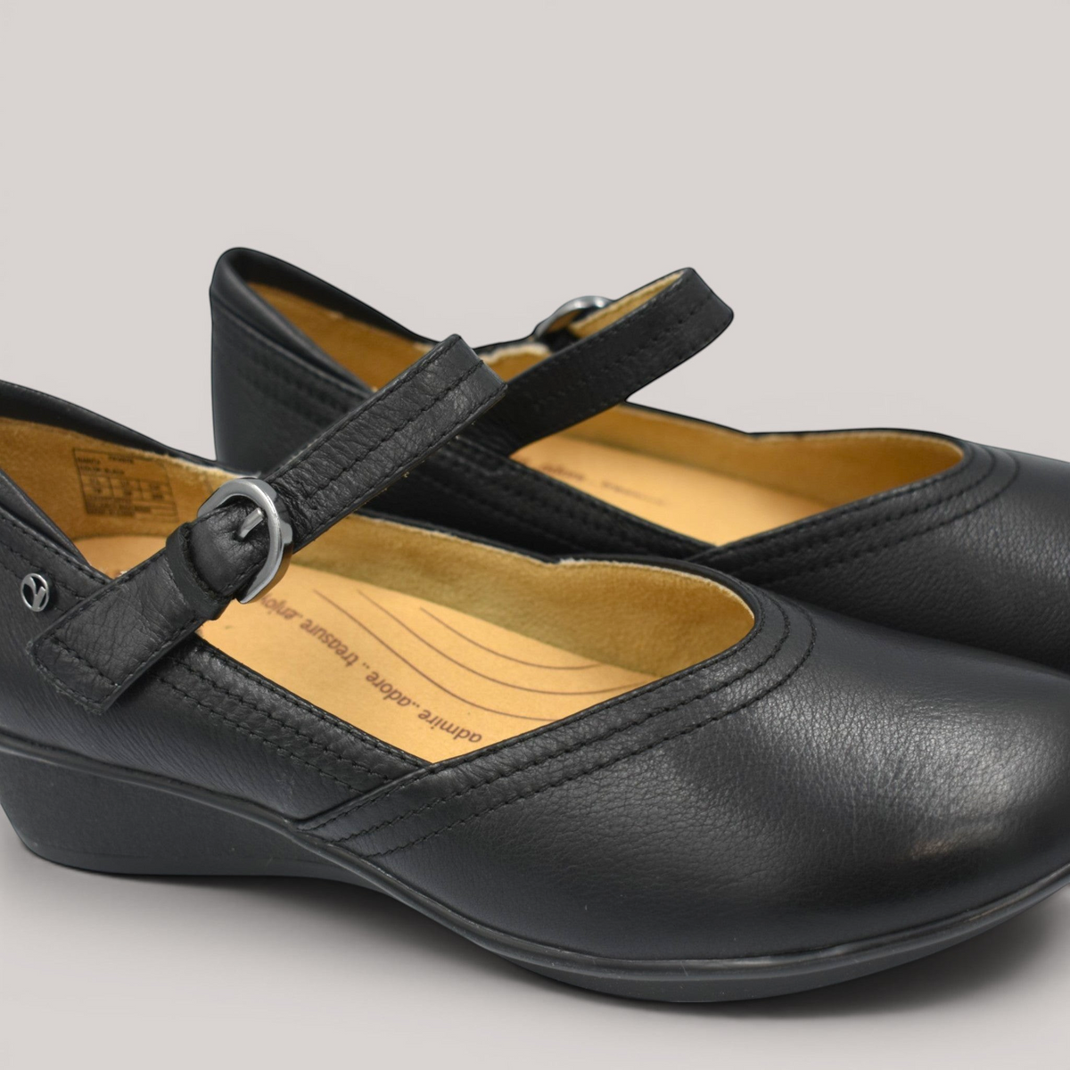 Grundy's Shoes Revere Narita black leather Mary-Jane shoes with adjustable strap and comfortable wedge heel.