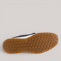 Grundy's Shoes ECCO S Lite Moc showing the brown rubber studded outsole with a white midsole and navy leather upper