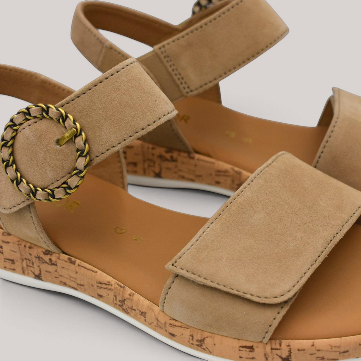 Grundy's Shoes Gabor 82734 beige nubuck sandals with decorative buckle, velcro strap, and cork-look wedge sole.