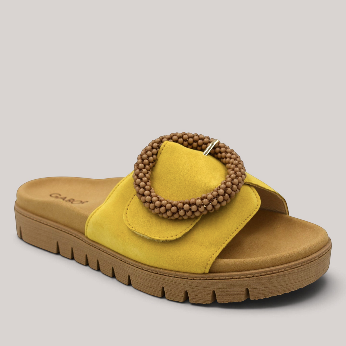 Grundy's Shoes Gabor yellow nubuck leather slide sandal with a beaded buckle and contoured footbed.