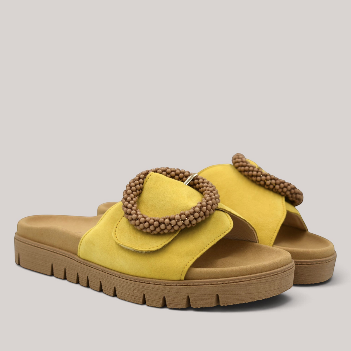 Grundy's Shoes Gabor 83745 yellow nubuck leather slide sandals with a beaded buckle and contoured footbed.