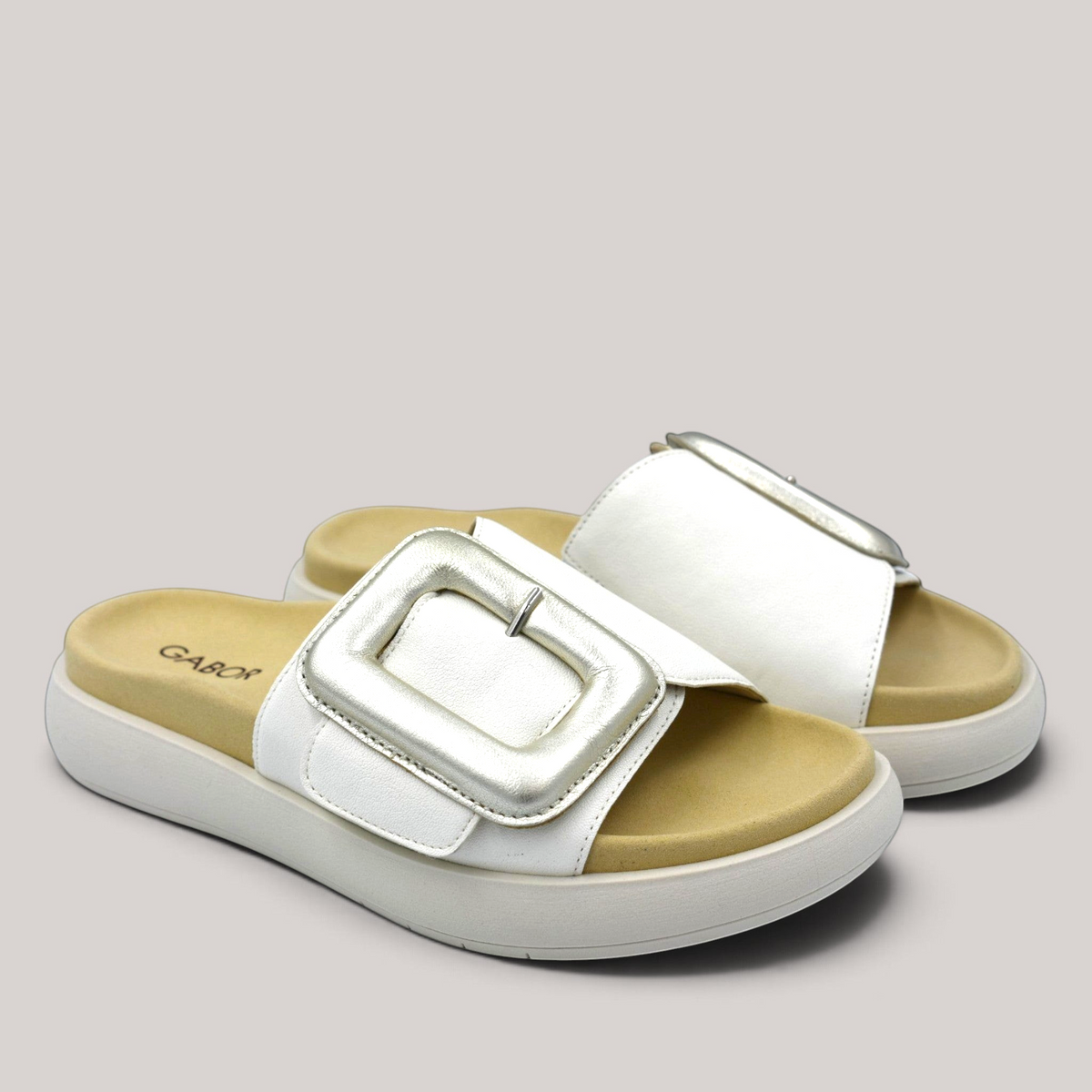 Grundy's Shoes Gabor 83751 white leather slide sandals with a large metallic buckle and contoured footbed.