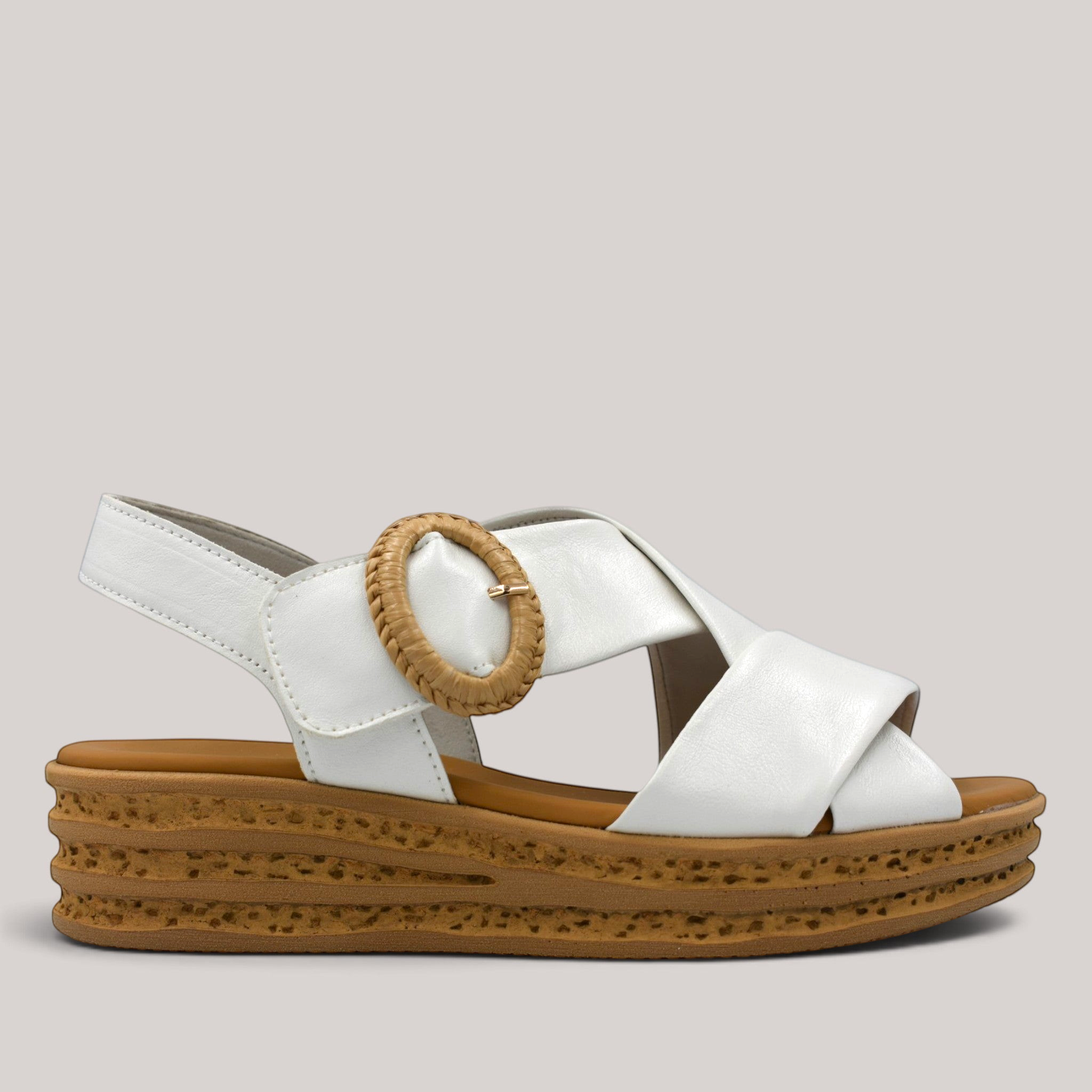 Grundy's Shoes Gabor 84556 white leather wedge sandal with crossover straps, decorative buckle, and cork-look sole.
