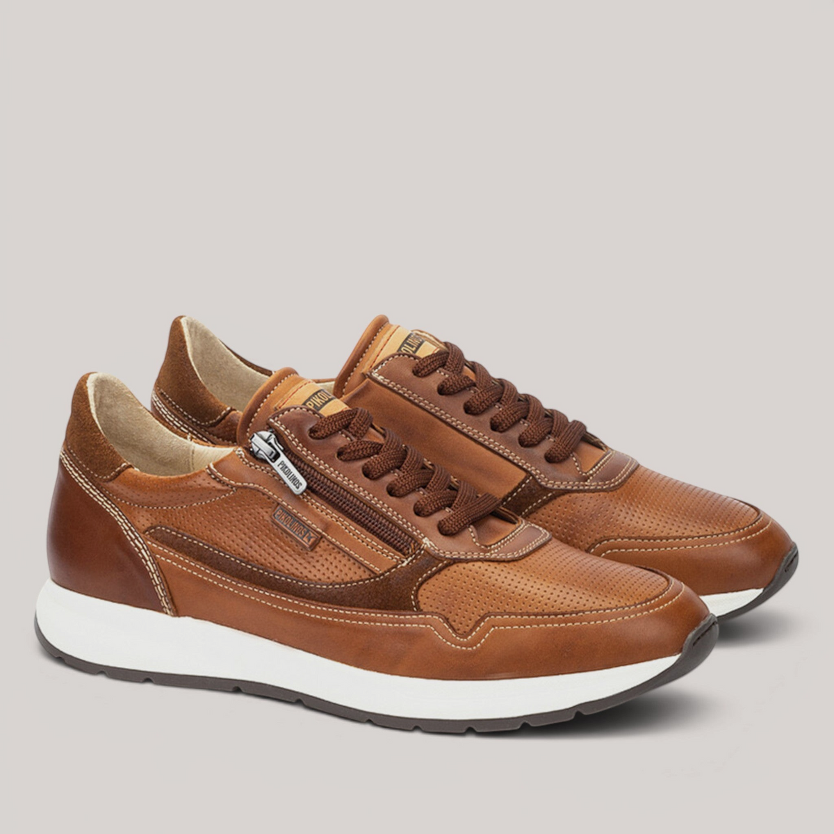 Grundy's Shoes Pikolinos Getafe men's brown leather sneakers with side zipper, lace-up closure, and white sole.