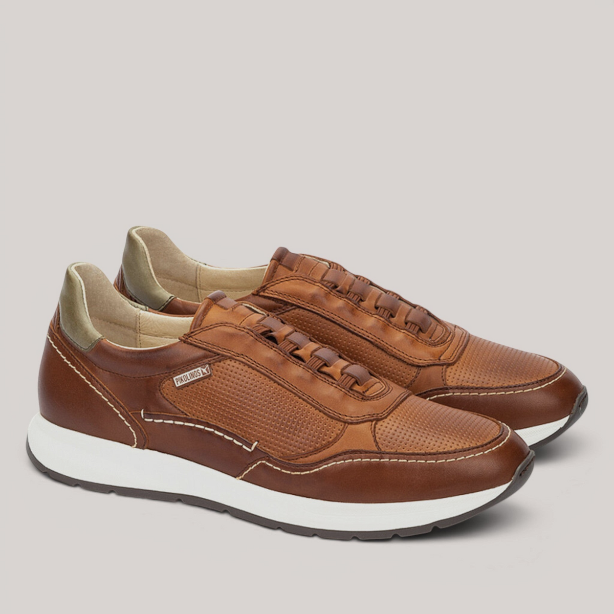 Grundy's Shoes Pikolinos Getafe brown leather trainers with perforated details, white sole, and elastic closure.