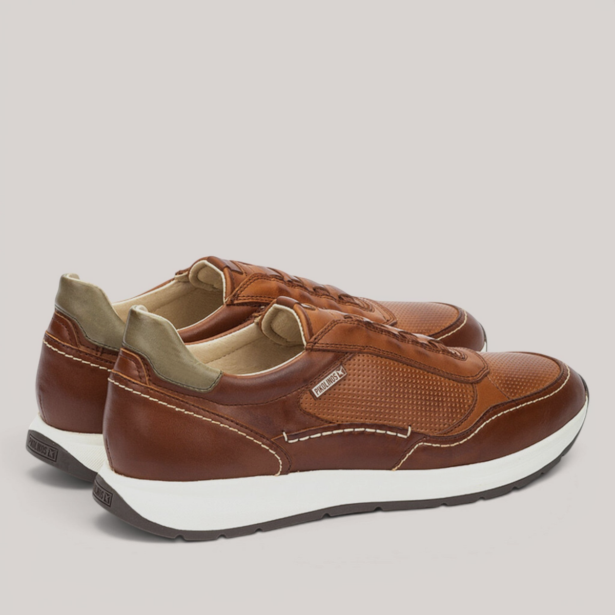 Grundy's Shoes Pikolinos Getafe brown leather trainers with perforated details, white sole, and elastic closure.