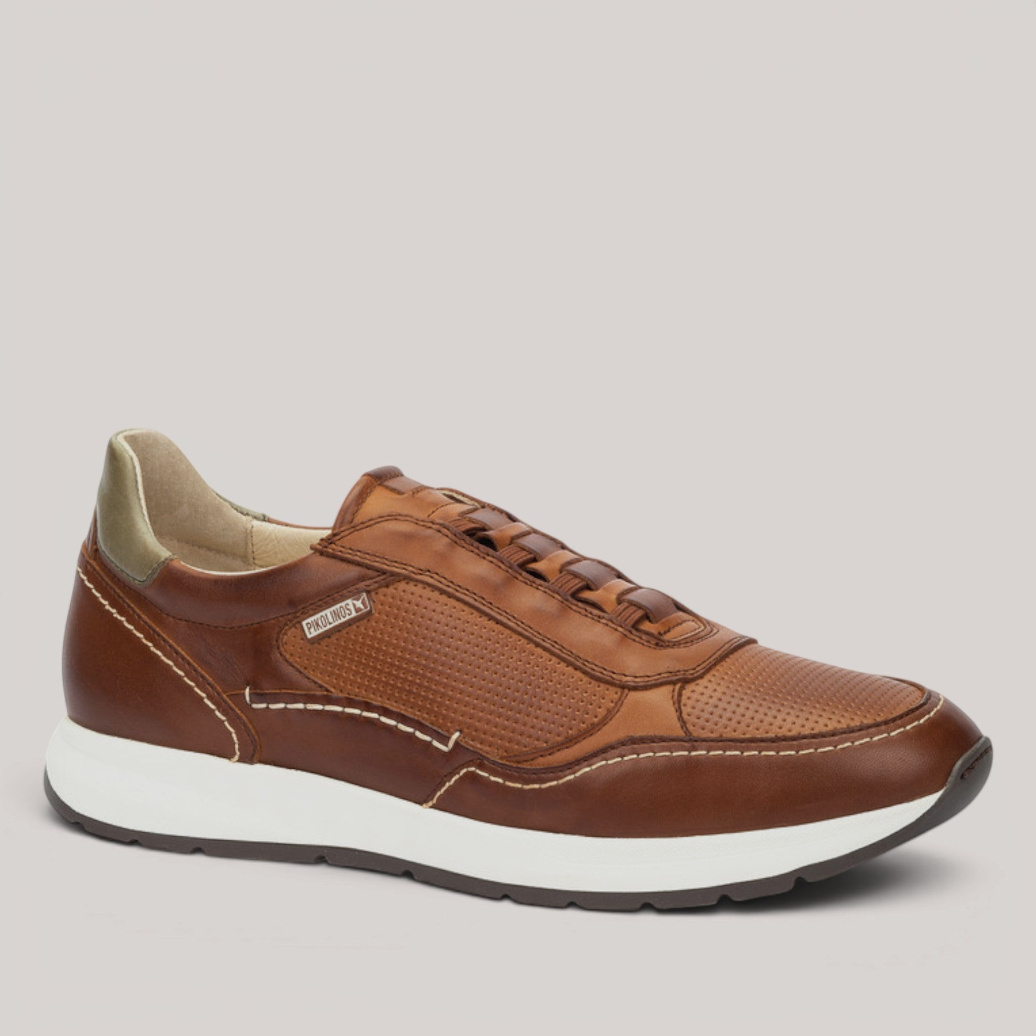 Grundy's Shoes Pikolinos Getafe brown leather trainers with perforated details, elastic laces, and white sole.