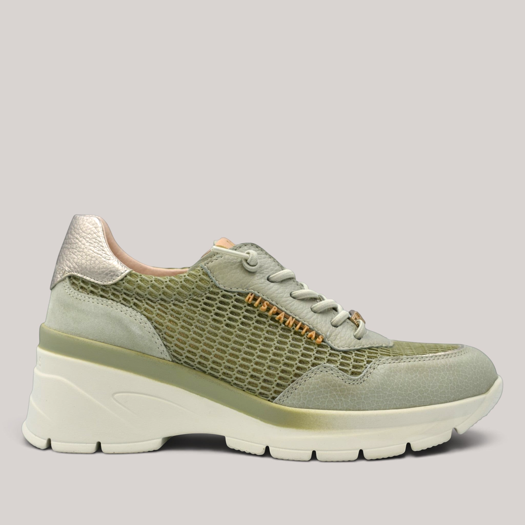 Grundy's Shoes Hispanitas jade wedge sneaker with leather and mesh panels, elastic laces, and metallic heel detail.