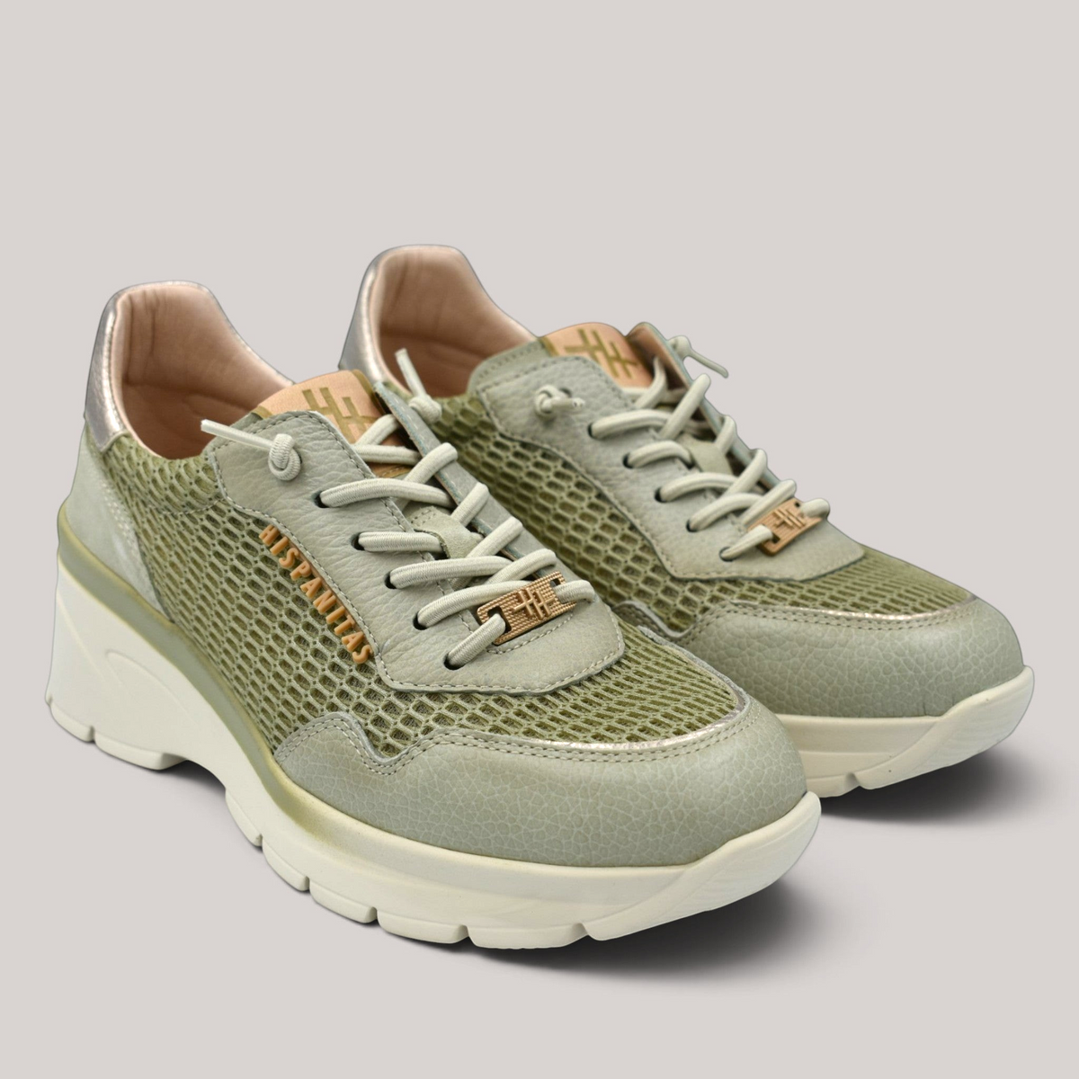 Grundy's Shoes Hispanitas Jade lace-up wedge sneakers in sage green leather and mesh with Triflow cushioning.