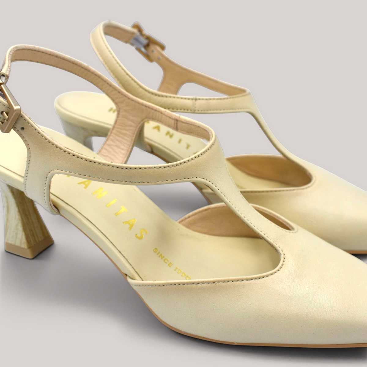 Grundy's Shoes Hispanitas Giorgia cream leather T-bar pumps with a pointed toe and wood-effect block heel.