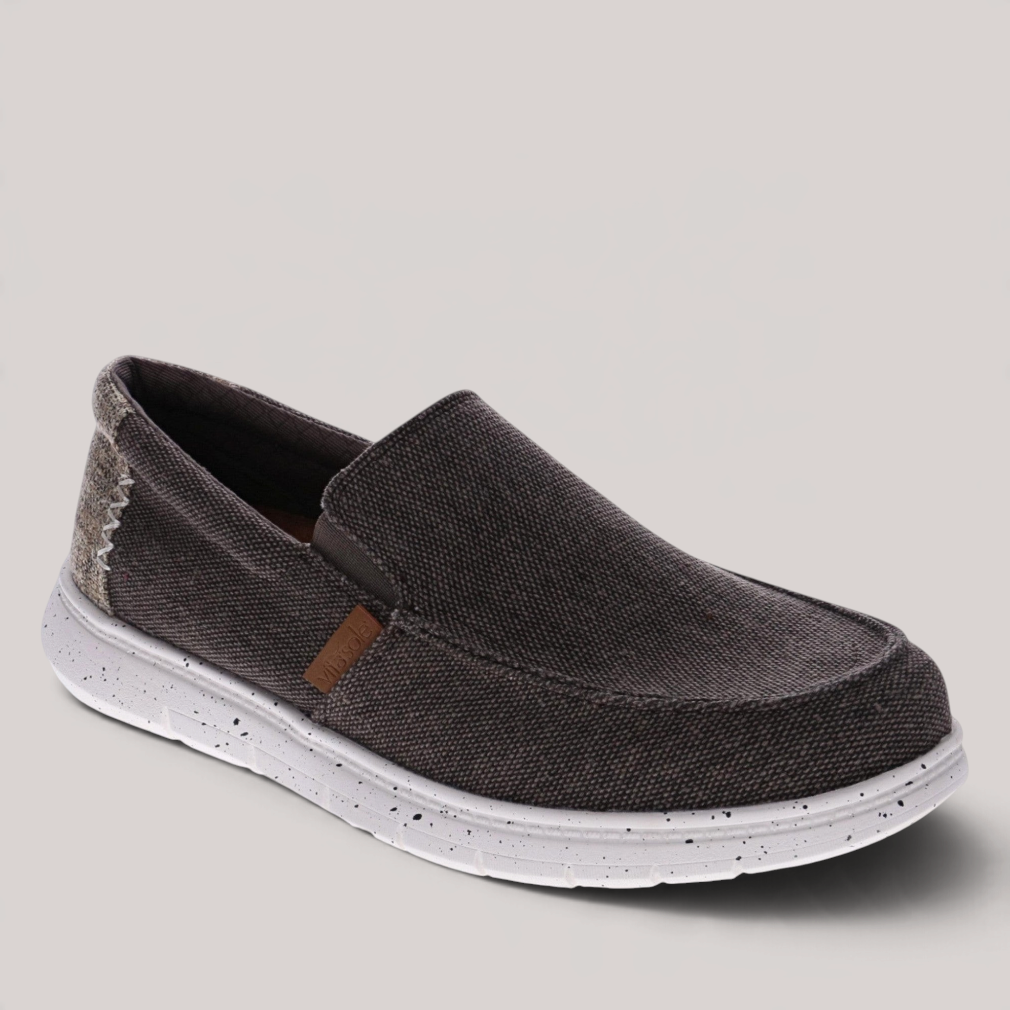 Grundy's Shoes Vitasole Harbour dark grey canvas slip-on shoe with white speckled lightweight sole and elastic laces.