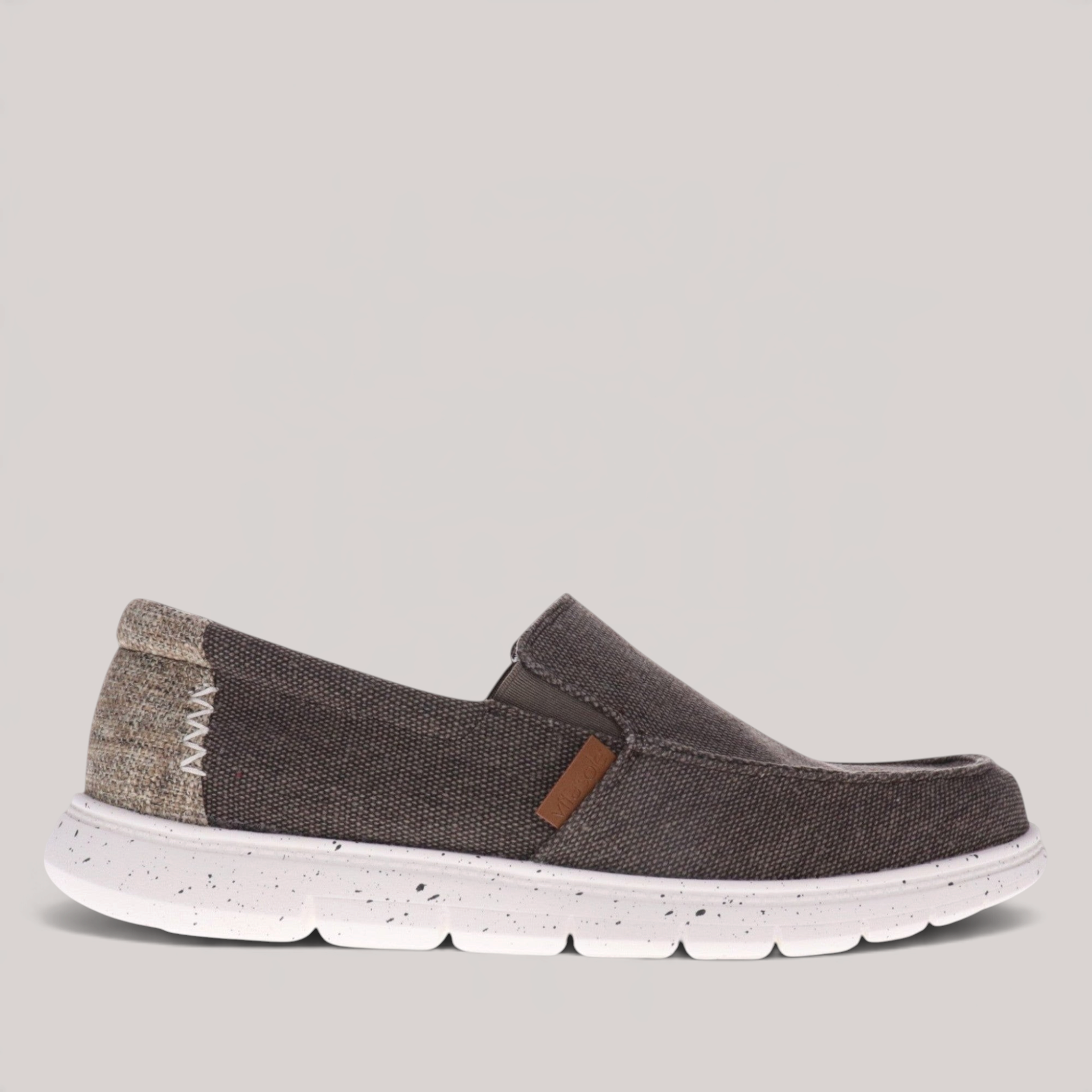 Grundy's Shoes Vitasole Harbour grey canvas slip-on shoe with a white speckled shock-absorbing sole and heel detail.