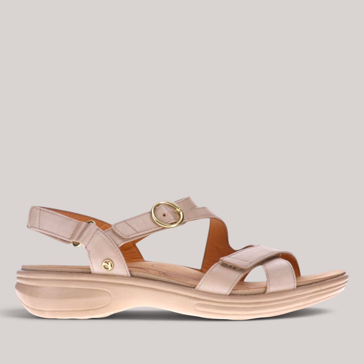 Grundy's Shoes Revere Nagoya beige leather sandal with adjustable straps, gold hardware, and cushioned footbed.