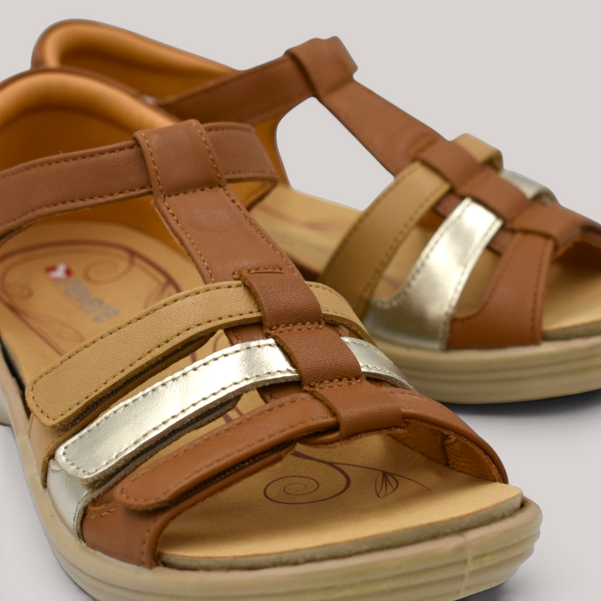 Grundy's Shoes Revere Seville multi-tone brown and metallic leather orthotic sandals with adjustable velcro straps.