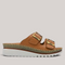 Grundy's Shoes Sala Oasis tan leather slip-on sandals with adjustable buckles and a cushioned platform sole.