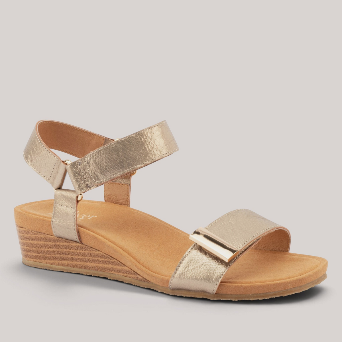 Grundy's Shoes Silver Lining Utica metallic gold leather wedge sandal with dual velcro straps and contoured footbed.