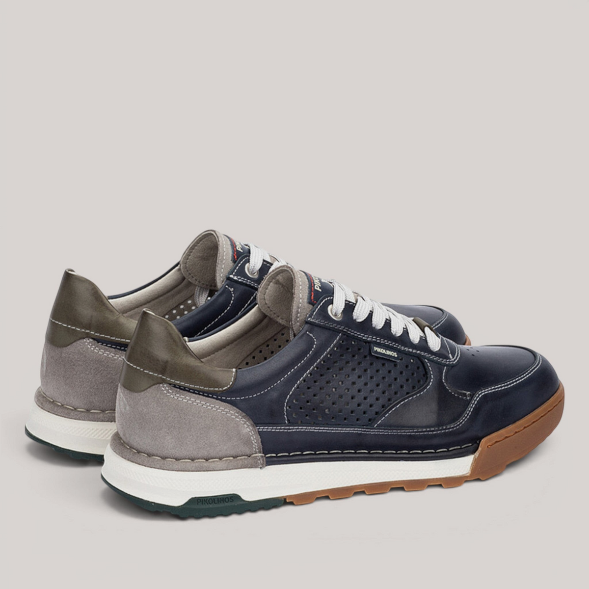 Grundy's Shoes Pikolinos Teide men's navy and grey leather trainers with perforated details and a sporty rubber sole.
