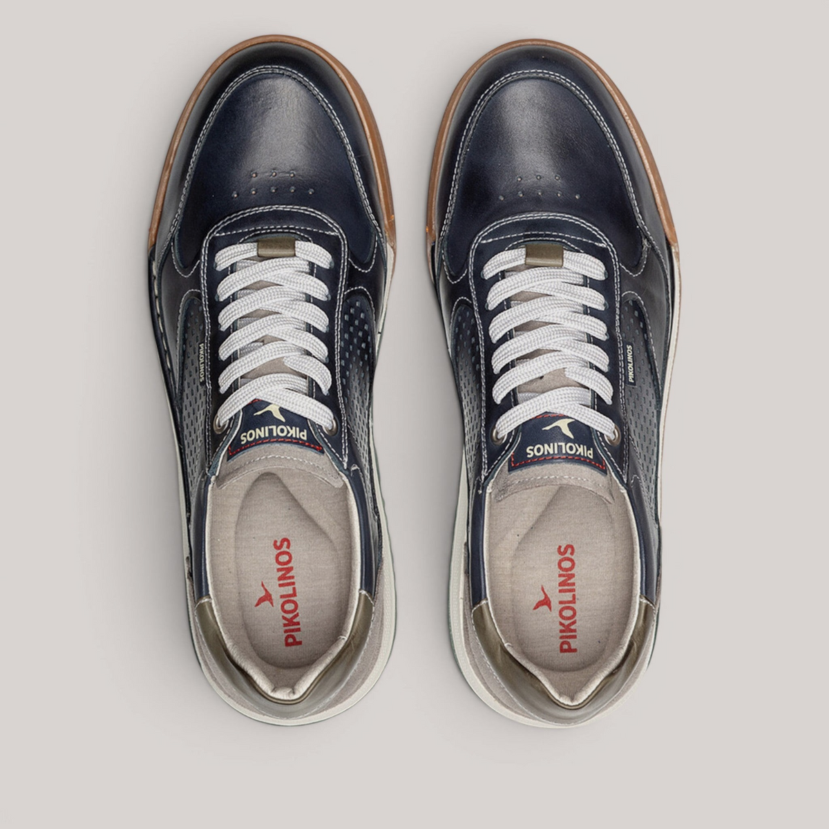 Grundy's Shoes Pikolinos Teide navy leather trainers with white laces, perforated details, and a lightweight sole.