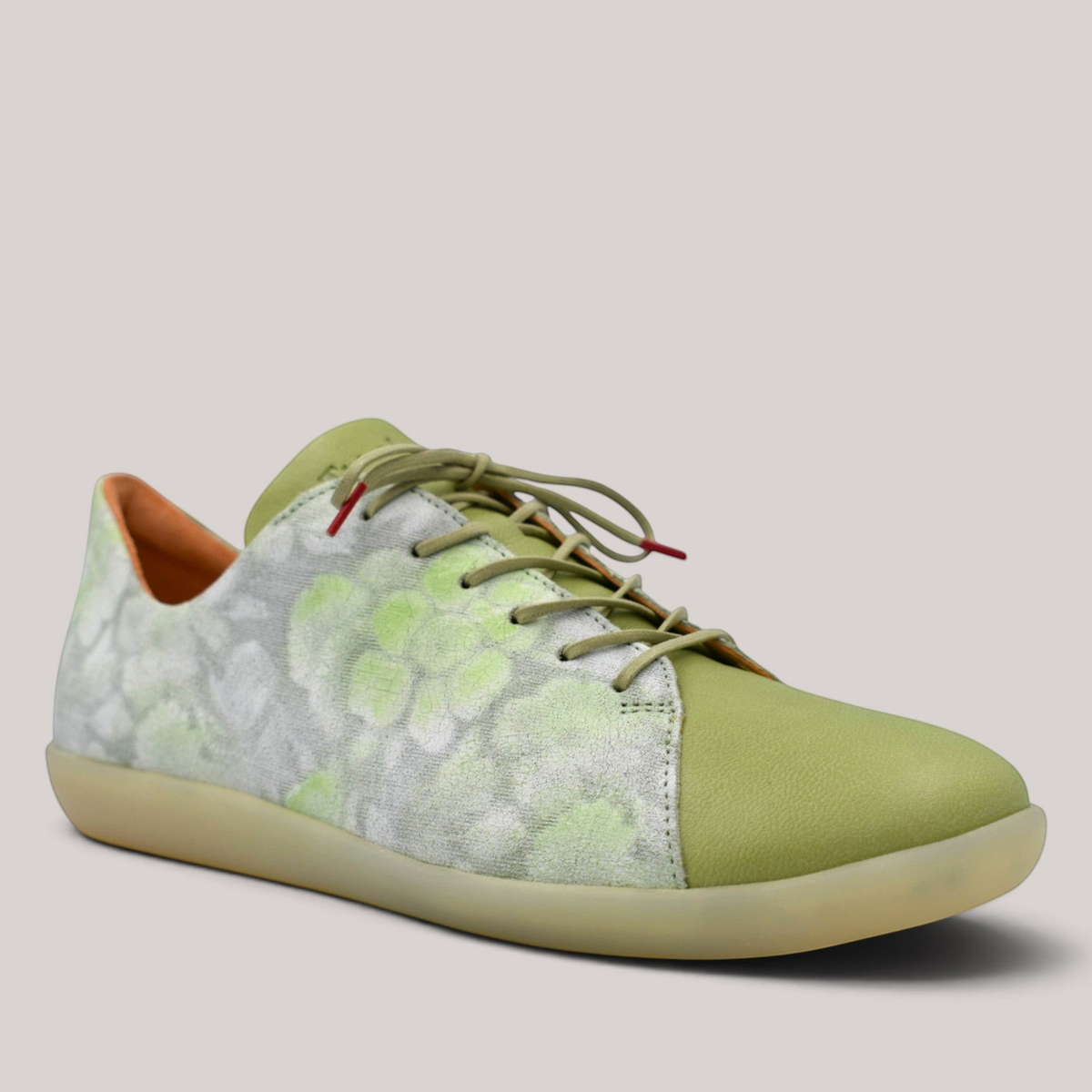 Grundy's Shoes Think 000946 lace-up sneaker in sage green leather with a patterned side panel and flat rubber sole.
