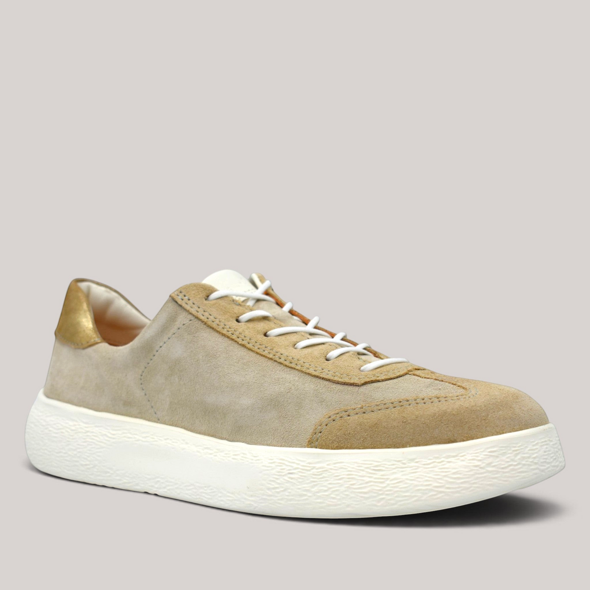 Grundy's Shoes Think lace-up sneaker in beige suede and nubuck leather with a metallic gold heel tab and white sole.