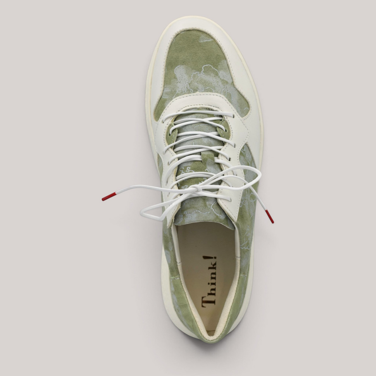 Grundy's Shoes Think 001303 lace-up sneaker in sage green and cream leather with a floral pattern and white laces.