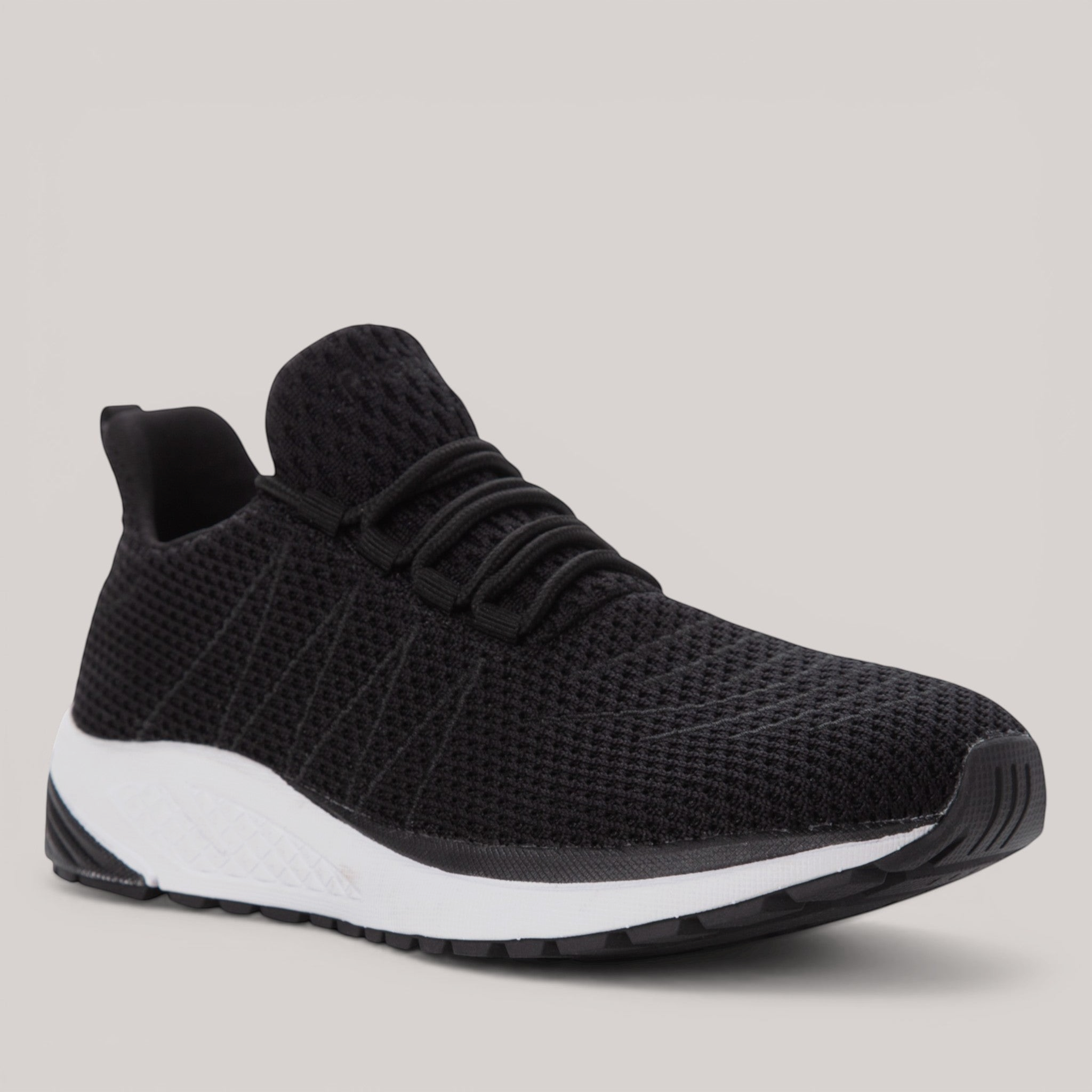 Grundy's Shoes Propet Tour Knit women's black mesh sneaker with a white EVA midsole and cushioned orthotic design.