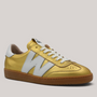 Grundy's Shoes Wonders 2001 gold textured leather sneaker with white logo detail and caramel rubber sole