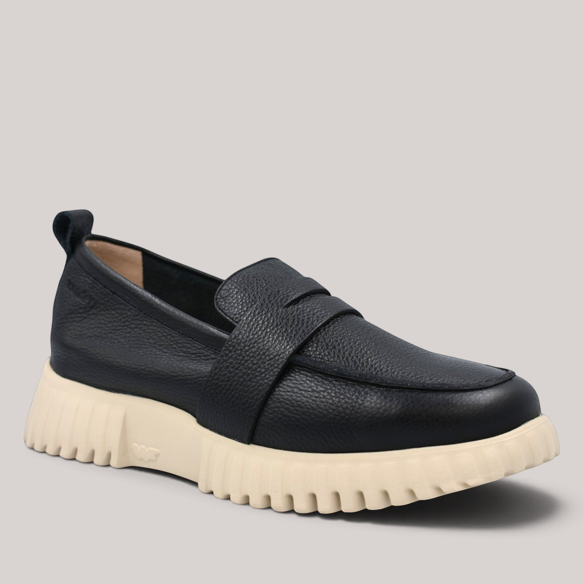 Grundy's Shoes Wonders 4410 black leather loafers with a chunky beige WondersFly sole and rear pull tab.