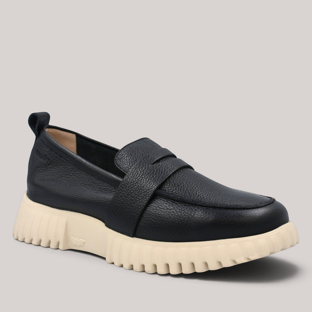 Grundy's Shoes Wonders 4410 black leather loafers with a chunky beige WondersFly sole and rear pull tab.