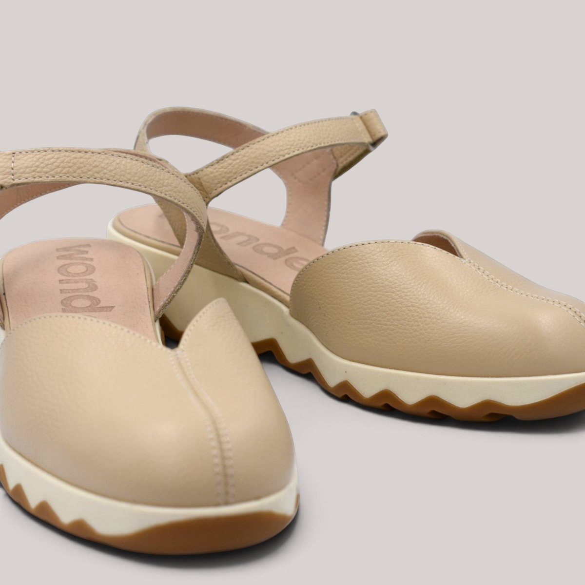 Grundy's Shoes Wonders 7601 beige leather slingback sandals with a cushioned platform sole and closed vamp design.