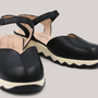 Grundy's Shoes Wonders 7601 black leather slingback shoes with a cushioned white EvoLight sole and side buckle.