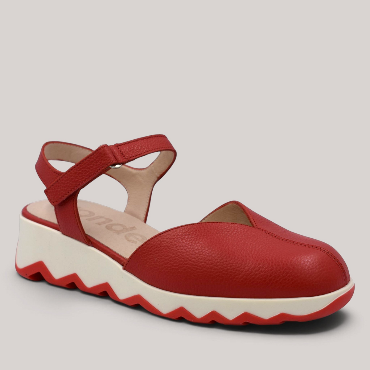Grundy's Shoes Wonders 7601 red leather slingback shoe with a white cushioned EvoLight sole and side buckle closure.