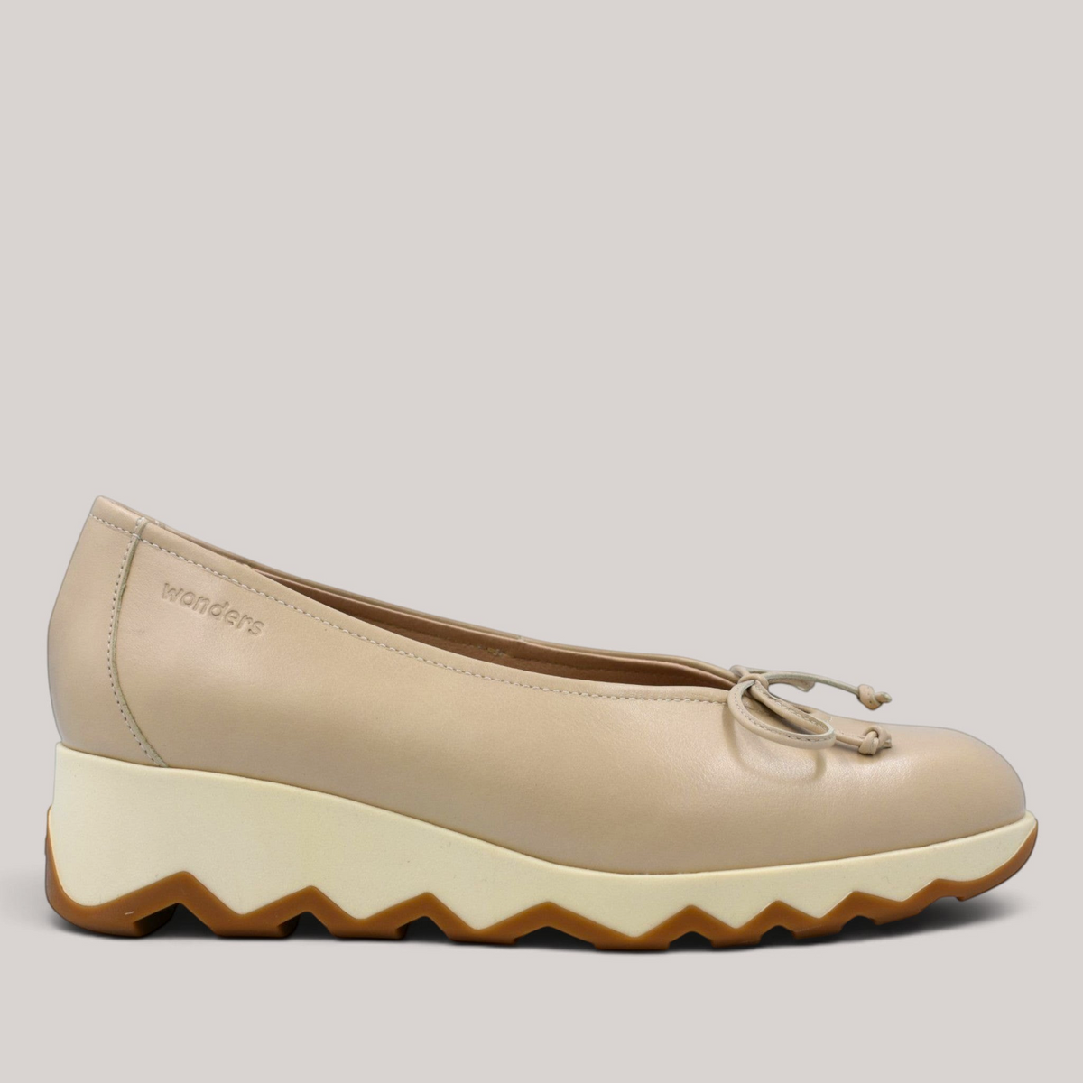 Grundy's Shoes Wonders 7621 beige leather ballet wedge with a signature bow detail and a slip-resistant sole.