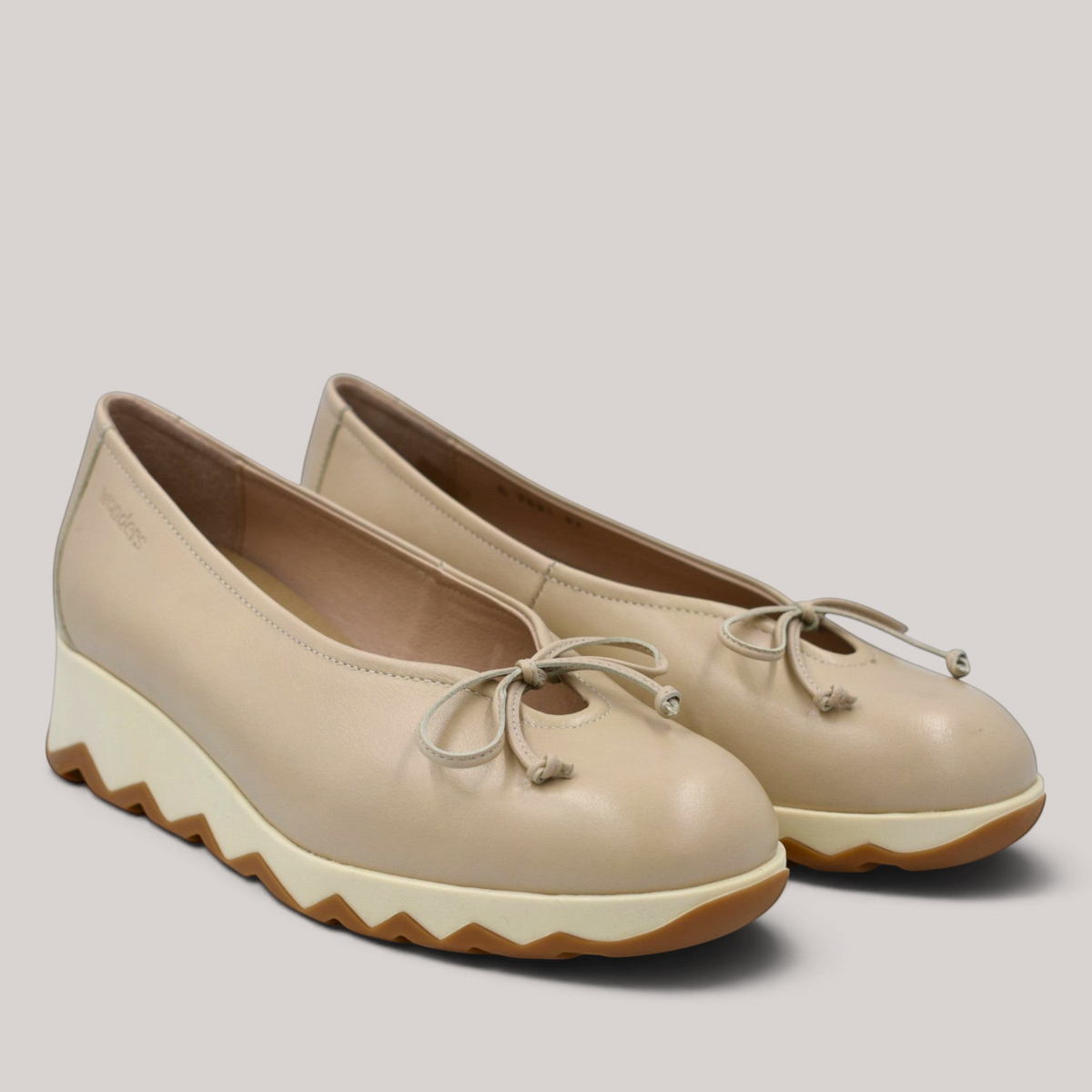 Grundy's Shoes Wonders 7621 beige leather ballet wedge with a bow detail and a lightweight slip-resistant sole.