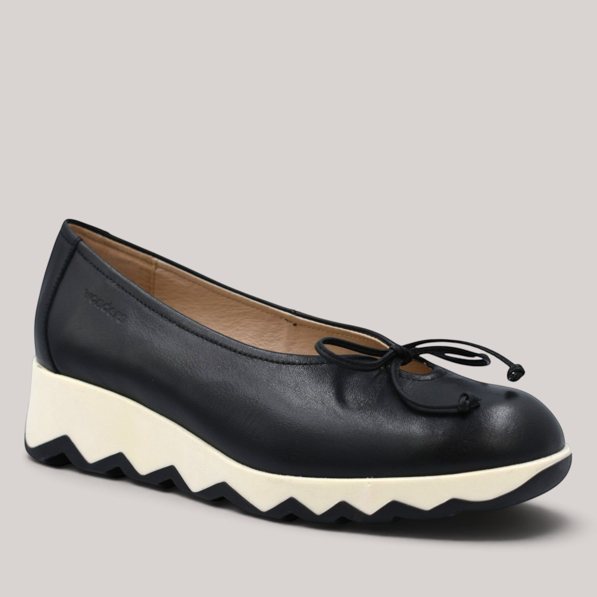 Grundy's Shoes Wonders 7621 black leather ballet wedge with a white serrated sole and delicate bow detail