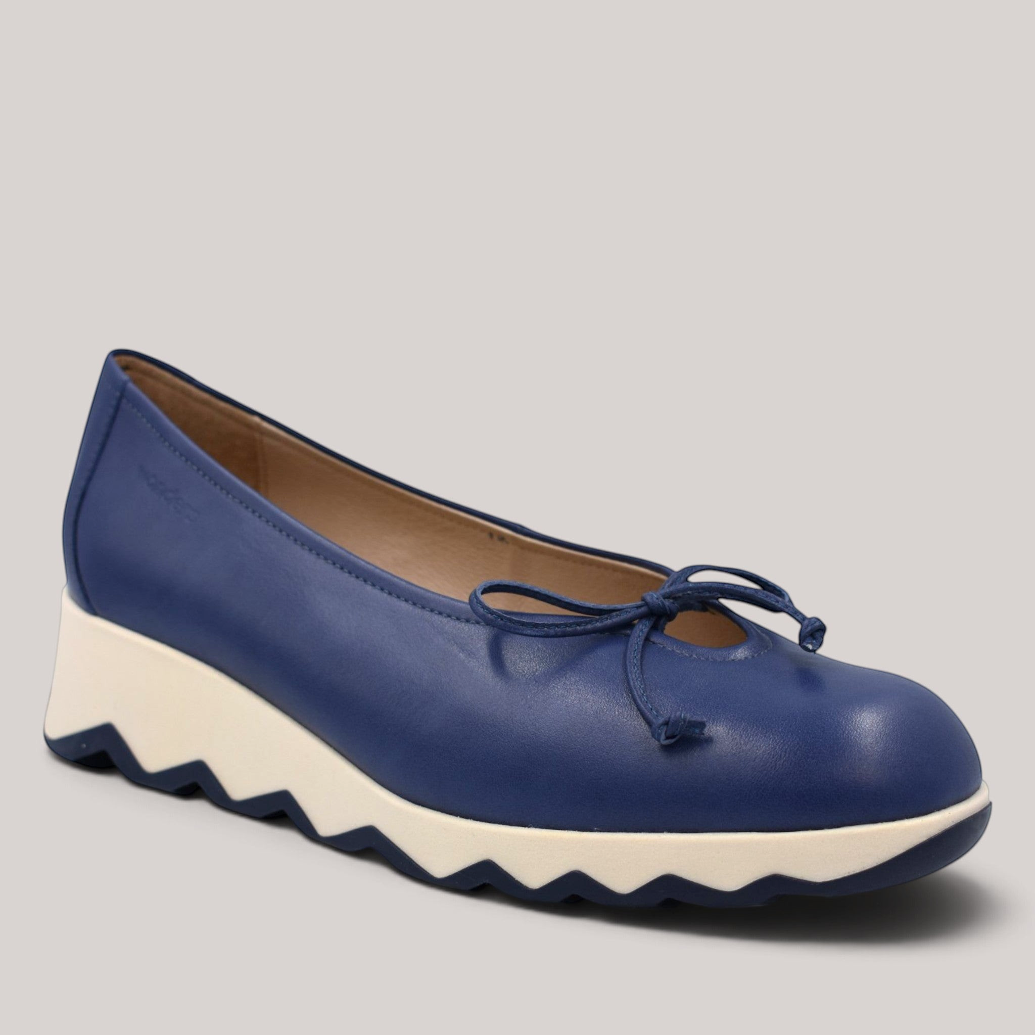 Grundy's Shoes Wonders 7621 navy blue leather ballet wedge with a bow detail and a white slip-resistant sole.