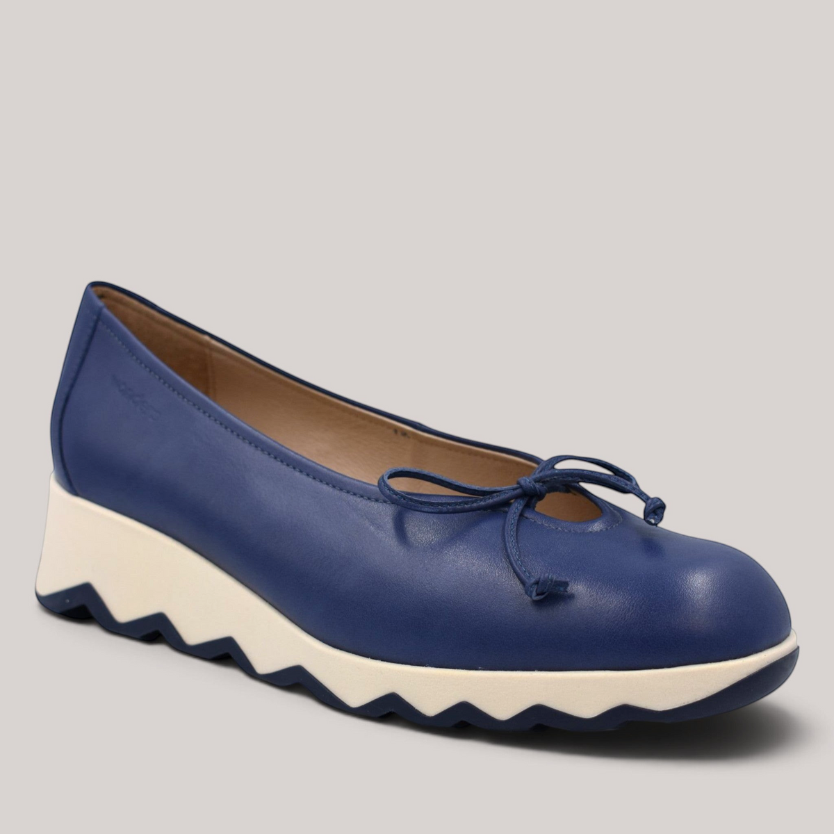 Grundy's Shoes Wonders 7621 navy blue leather ballet wedge with a bow detail and a white slip-resistant sole.